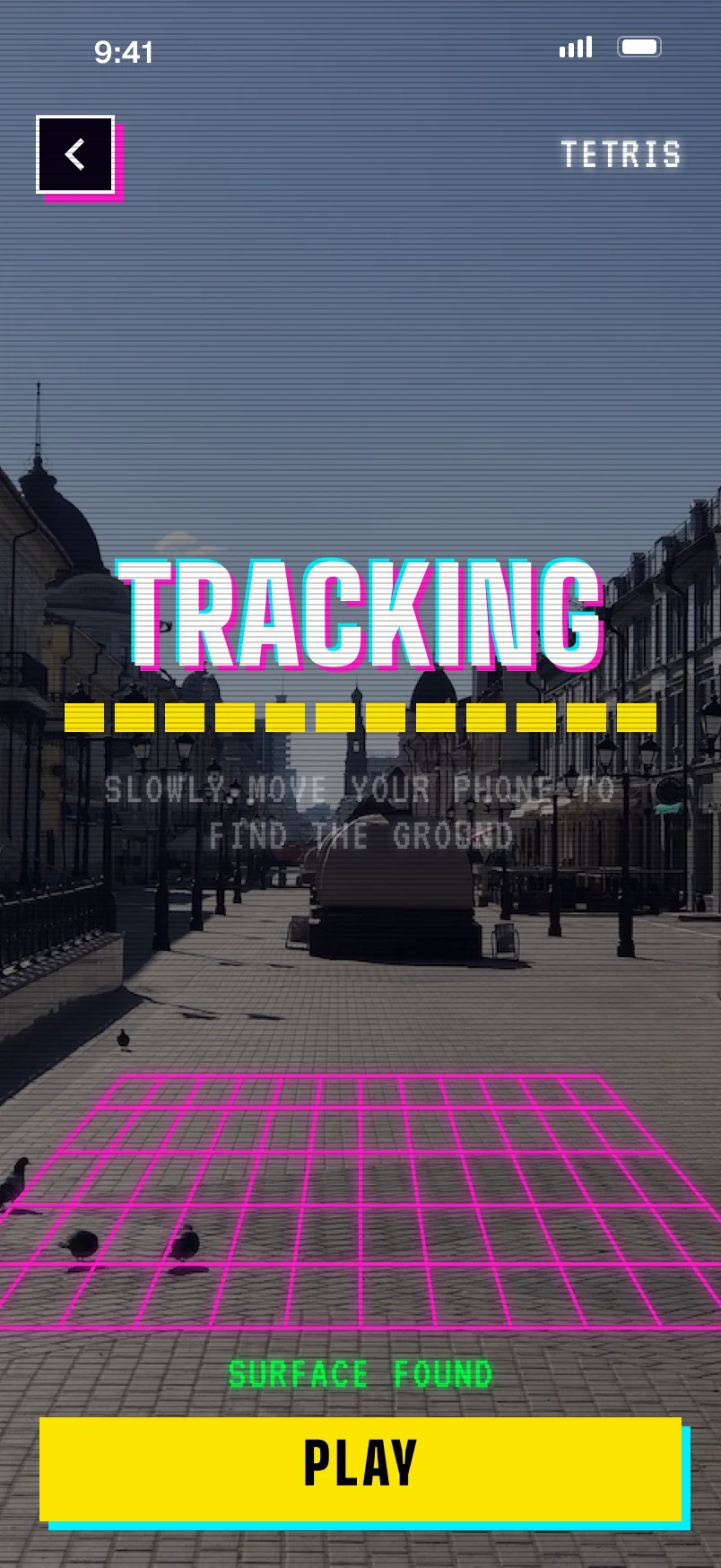 Tracking: a street in Kazan behind a dark veil, a filling bar, slowly move your phone to find the ground, a magenta grid on the pavement, surface found, Play.
