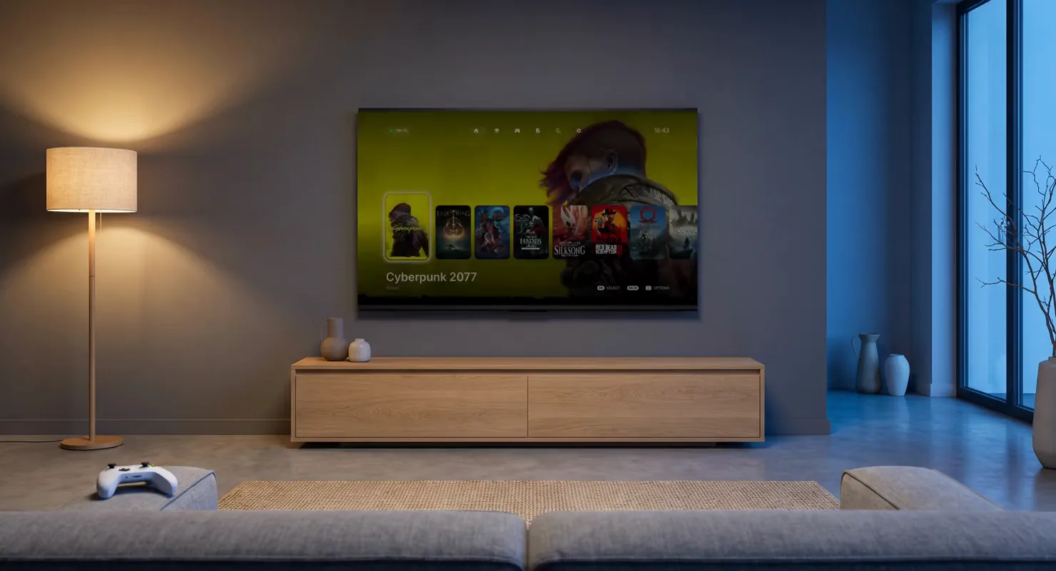 A living room: the CouchDeck library on the TV, covers moving under the focus ring, then a game starts.